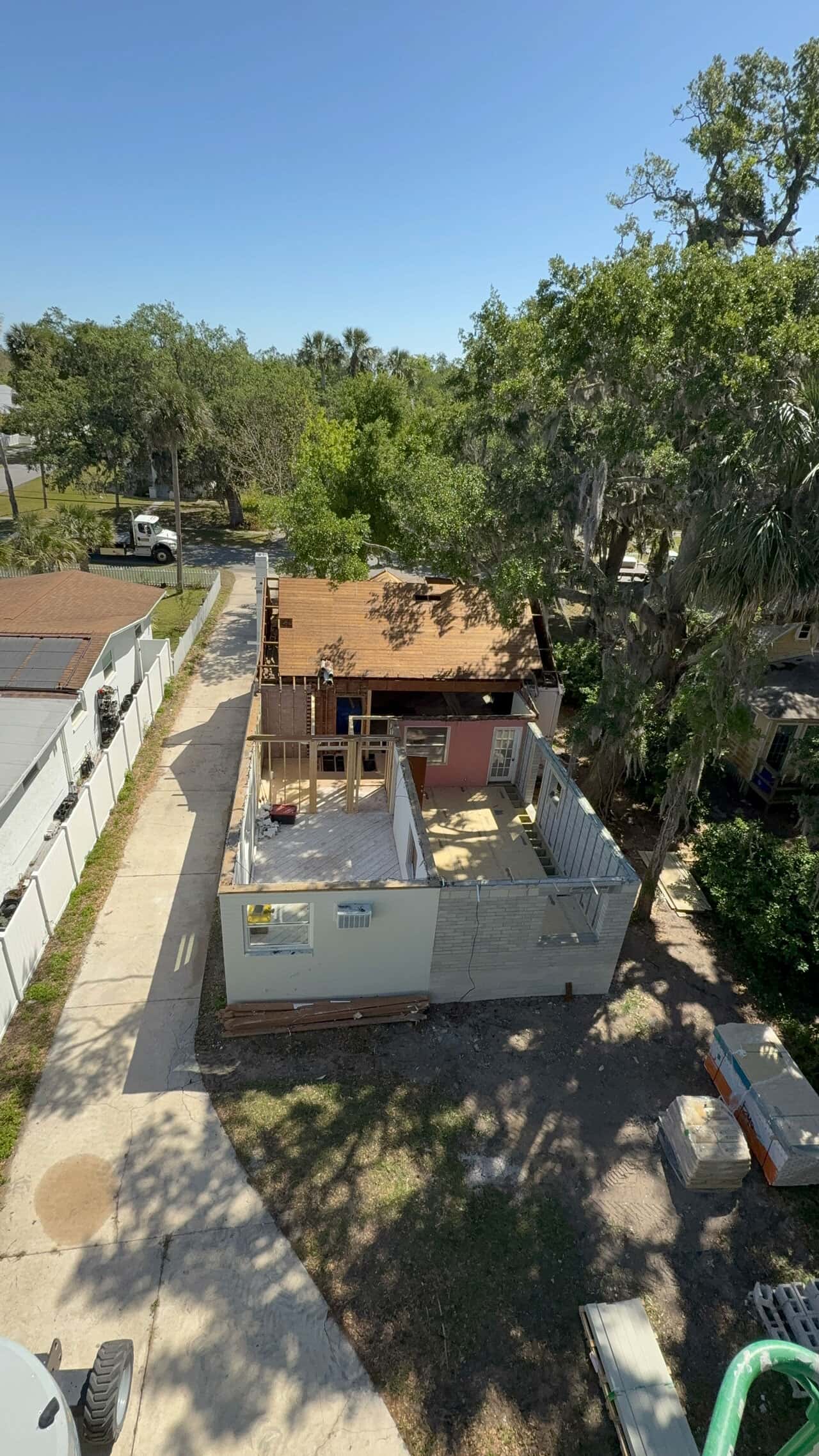 Overhead photo shot by a drone overlooking new addition being added to existing house by The Menke Corp