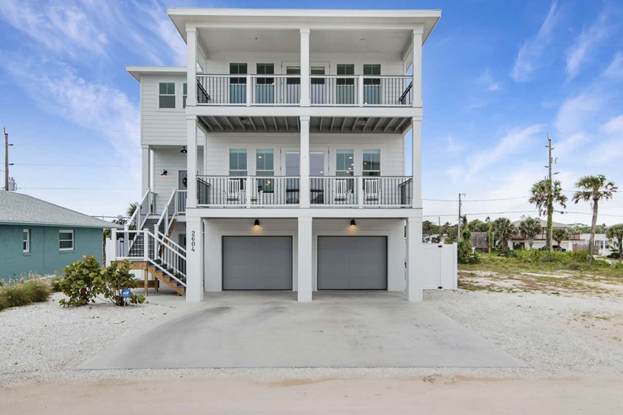 Photo of white 3 story home custom built by The Menke Corp